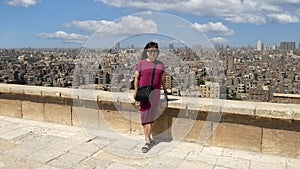 Female Korean tourist in the garden and forecourt of the Alabaster Mosque in the Cairo Citadel, Egypt.