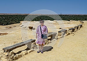 Female Korean tourist at Gebel Al Mawta, the `Mountain of the Dead`, in Siwa Oasis, Egypt.