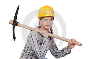Female laborer posing with axe photo