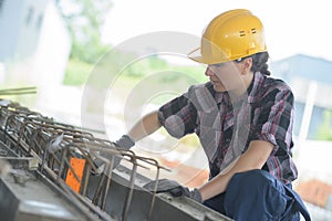 Female labourers work on city centre construction site