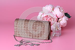 Female lady clatch bag on pink background
