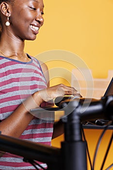 Female with laptop for bike maintenance