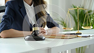 Female lawyer or business legal consultant sits at her office desk. cropped image