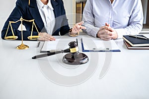 Female lawyer or Counselor working in courtroom have meeting with client are consultation with contract papers of real estate, Law