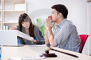 The female lawyer meeting with his male client in the office