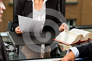 Female Lawyer or notary in her office