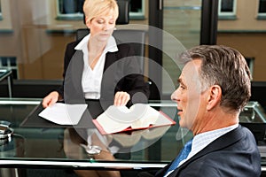 Female Lawyer or notary in her office