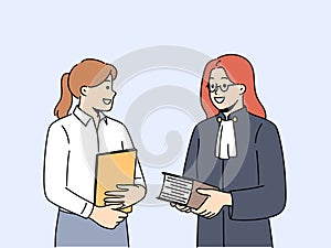 Female lawyer and paralegal in office