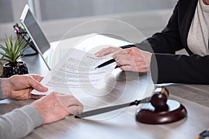 Female lawyer showing a document to her client