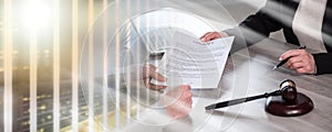 Female lawyer showing a document to her client; multiple exposure