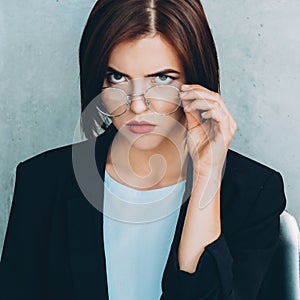 Female leader skeptic business woman eyeglasses