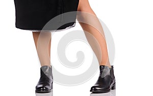 female legs in black boots