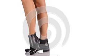 female legs in black boots