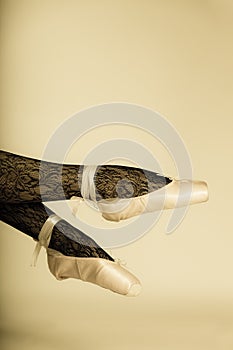 Female legs dancer in ballet shoes