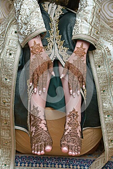 Female legs and hands with henna tattoo. moroccan bride`s showing mehndi design. mehndi hands and feet. beautiful female hands wi