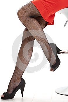 female legs in high heels fishnet stockings