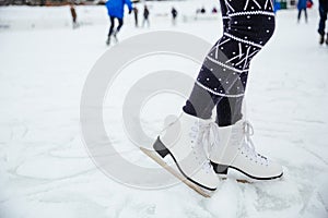 Female legs in ice skates