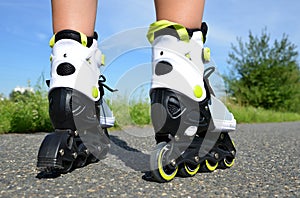 Female legs in inline skates.