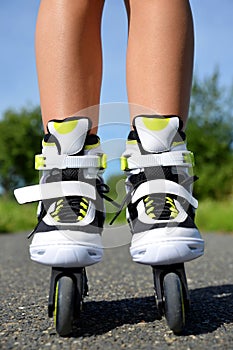 Female legs in inline skates.