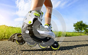 Female legs in inline skates.