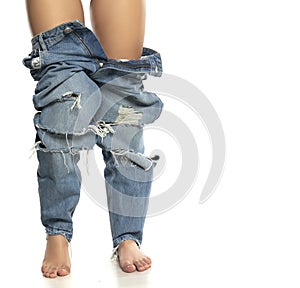 Female legs with jeans down