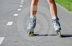 Female legs in roller blades