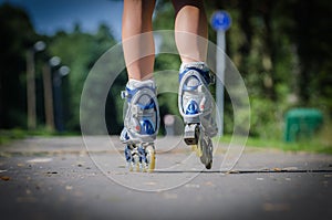 Female legs in roller blades