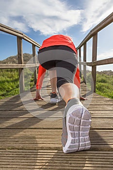 Female legs with running shoes ready to training