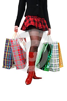 female legs with shopping bags
