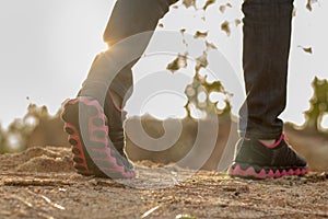 Female legs walking. Female hikers travel nature mountain map na