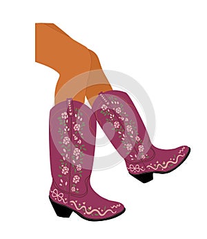 Female legs wearing a pair of pink cowboy boots