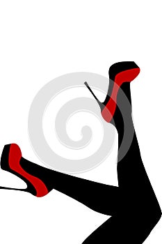 Female legs wearing red shoes with high heels photo