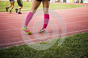 Female legs wearing sport equipment