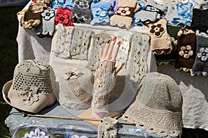 Female linen hats and wristlets at market trade