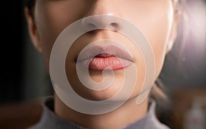 female lips before applying permanent makeup in a beauty salon with a contour on them. female beauty concept.