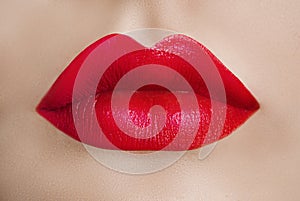 Female lips close up. Red lipstick. Sensuality.