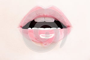 Female Lips with Pink Lip Gloss. Wet Lips with Makeup