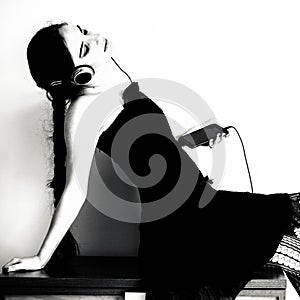 Female listening to music from phone