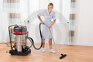 Female Maid With Vacuum Cleaner