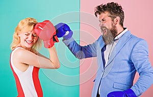 Female and male boxers fighting in gloves. Domination concept. Gender battle. Gender equal rights. Gender equality. Man