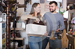 female and male choosing useful things for interior