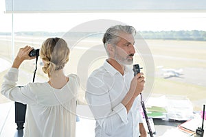 Female and male control tower worker