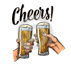 Female and male hands holding and clinking with two glasses beer