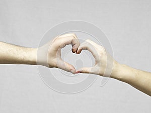 Female and Male Hands Making a Heart Shape