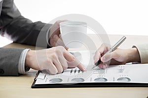 Female and male hands pointing at business