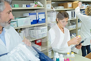 female and male pharmacists in pharmacy