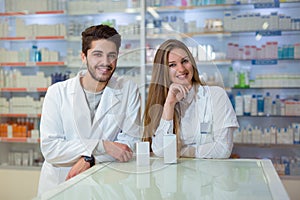 Female and male pharmacists in pharmacy