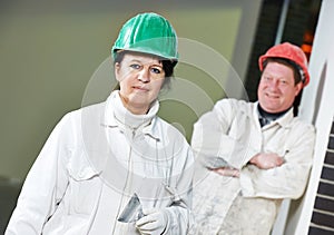 Female and male plasterers portrait