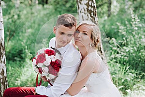 Female and male portrait. Lady and guy outdoors.Wedding couple in love, close-up portrait of young and happy bride and groom at we