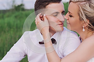 Female and male portrait. Lady and guy outdoors.Wedding couple in love, close-up portrait of young and happy bride and groom at we